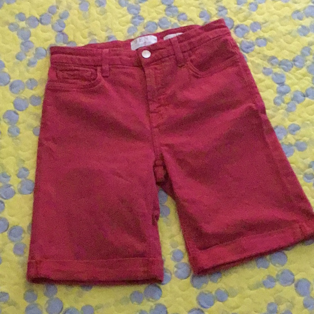 JEN7 stretch Bermuda shorts in a washed/weathered orange shade.